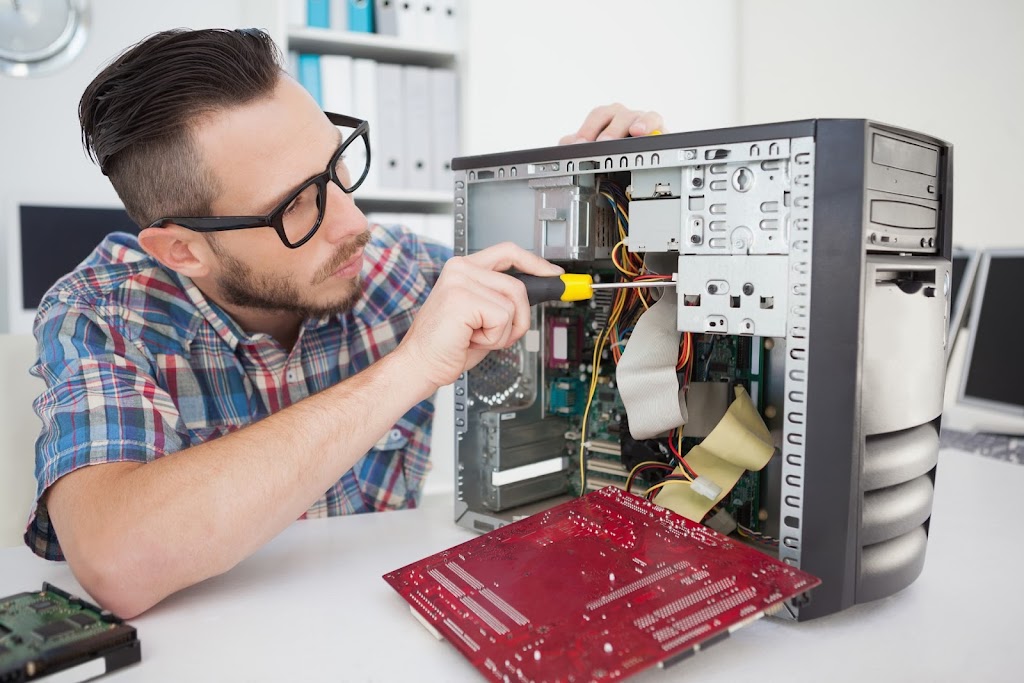 person fixing computer system cpu hardware