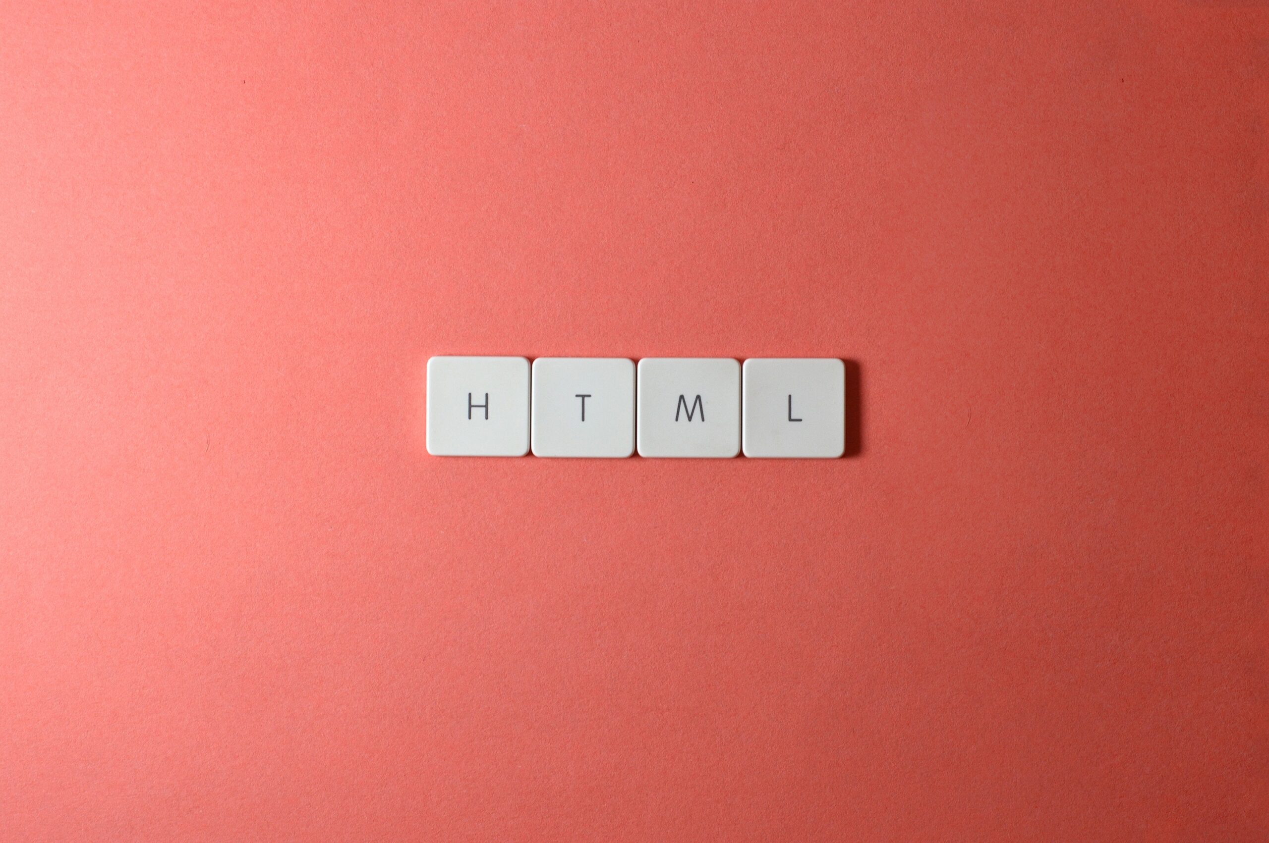html written on orange canvas background